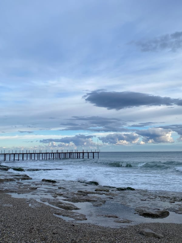 Storm clouds gather over choppy seas at Alanya beach
