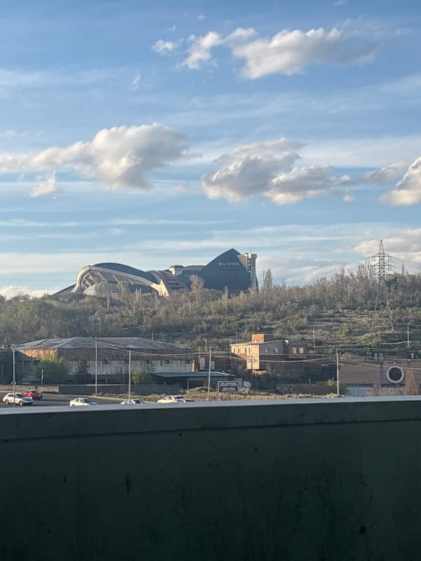Witness documents afternoon cityscape views from elevated Yerevan structure