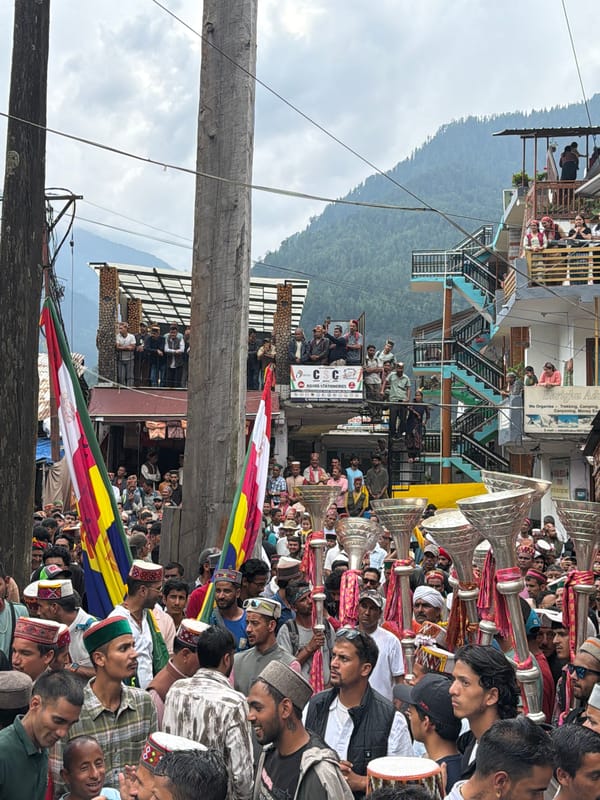 Religious procession winds through Vashisht with traditional music and crowds
