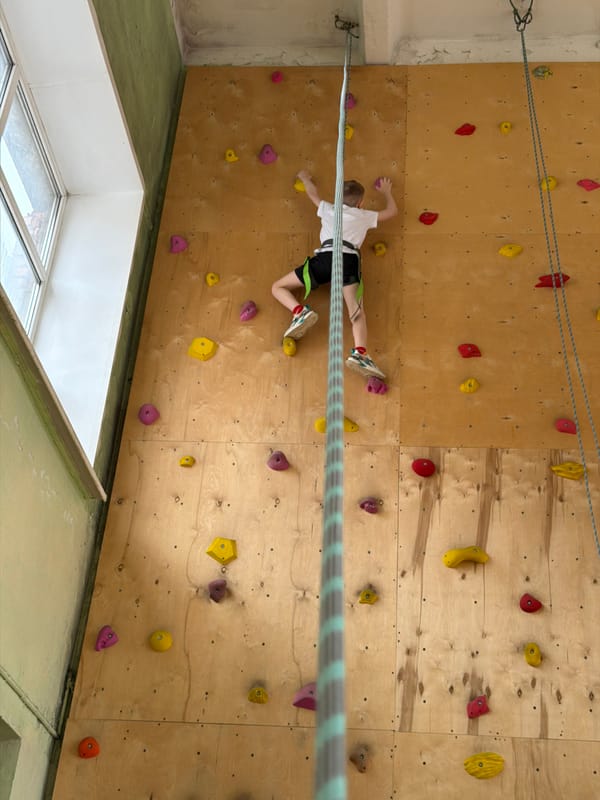 Child practices indoor rock climbing in Izhevsk facility
