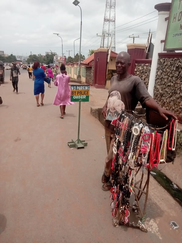 Street vendors conduct daily business across Onitsha markets