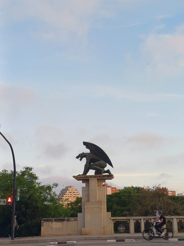 Winged statue observed on pedestal in Valencia, Spain