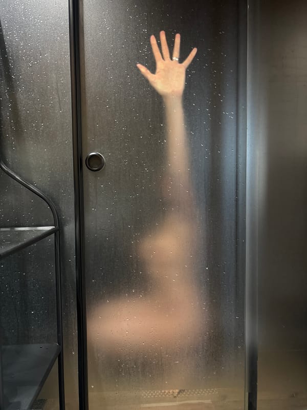 Morning shower routine captured behind steamed glass in Chaikovsky