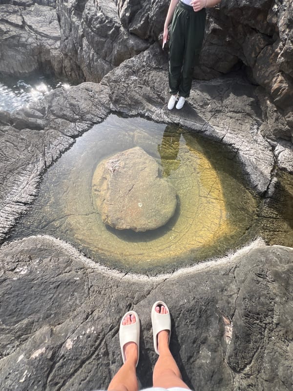 Tourist takes selfies at Montenegro lighthouse overlooking Adriatic Sea