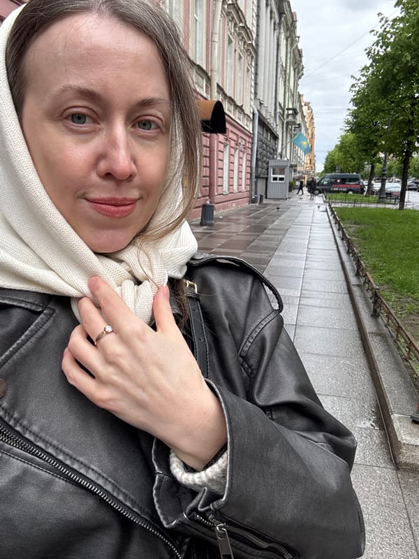 Woman takes selfie on historic Saint Petersburg street