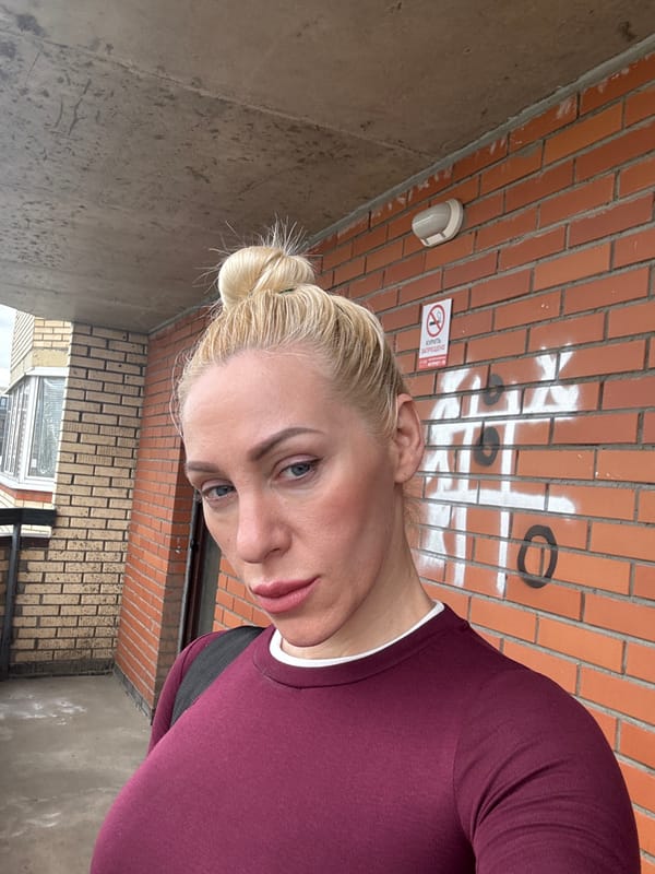Woman takes selfies in urban neighborhood setting
