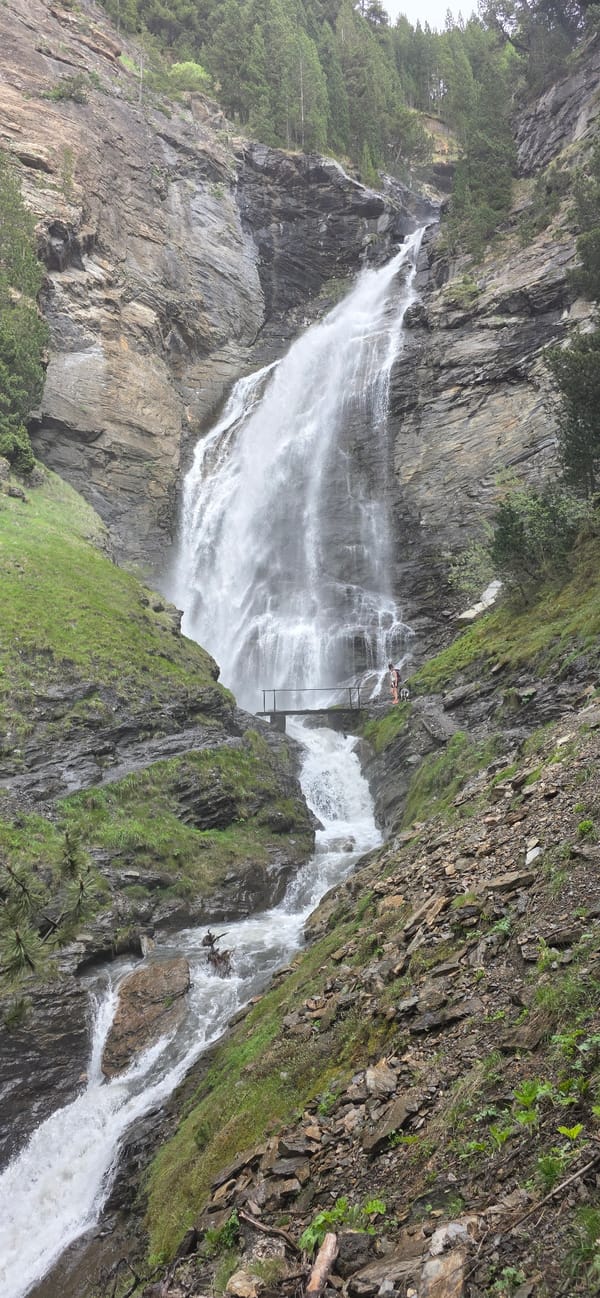 Visitors document waterfalls and bridges in Benasque Spain