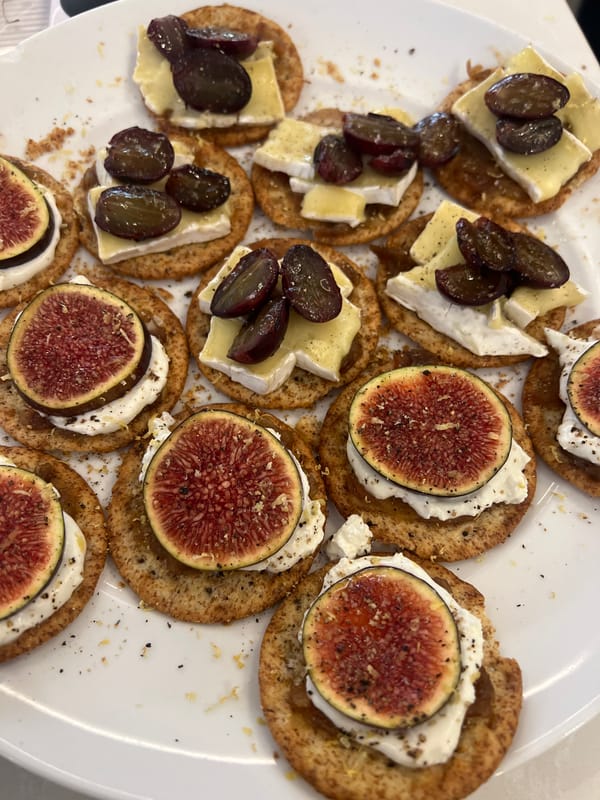 Man enjoys cheese and fruit platter in London building