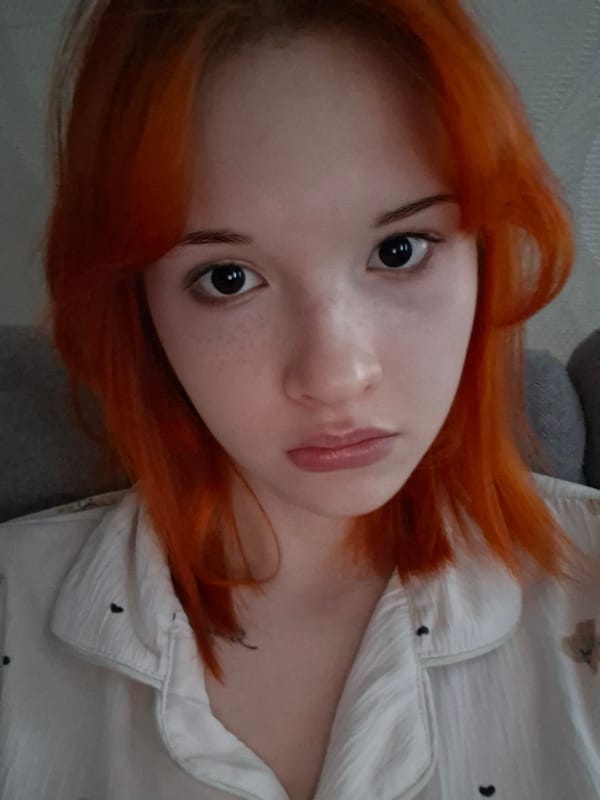 Red-haired individual photographed in portrait series in Chaikovsky, Russia