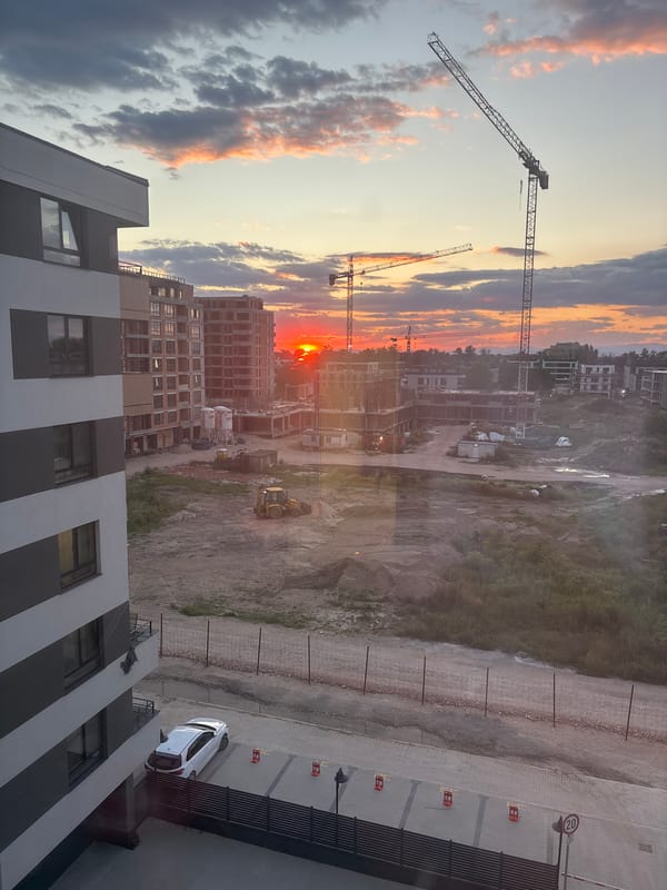 Urban construction site at sunset, two angles