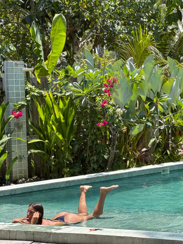 Woman swimming in tropical pool in General Luna, Philippines