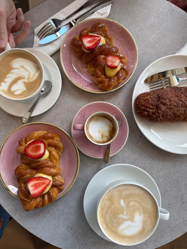 Morning café scene and sidewalk gathering documented in Riga