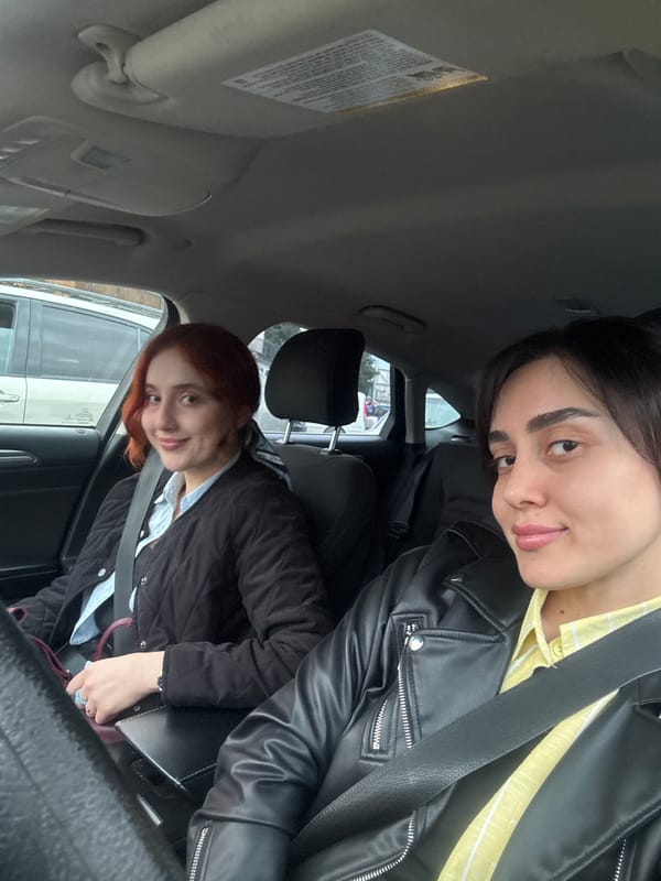 Young women photographed in car portraits in Tbilisi