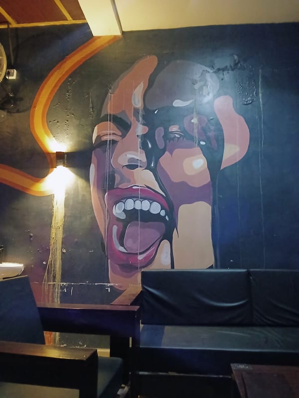 Indoor venue scenes documented in Kitwe with mural art