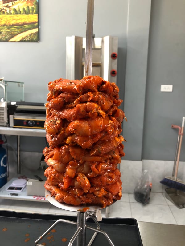 Late-night food prep: Chicken shawarma preparation in Kathu