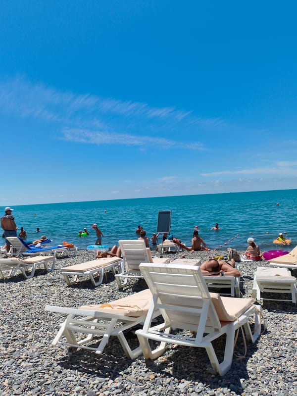 Tourists enjoy sunny beach day in Sochi, Russia