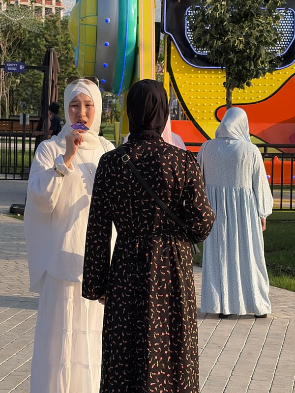Park visitors enjoy casual afternoon at amusement area