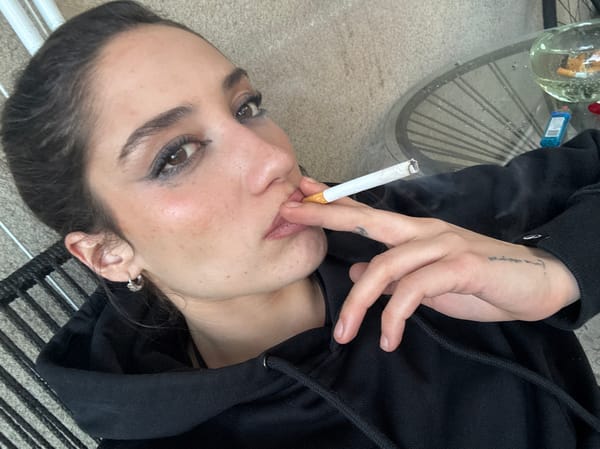 Young woman photographed smoking, wearing tiara in Buenos Aires