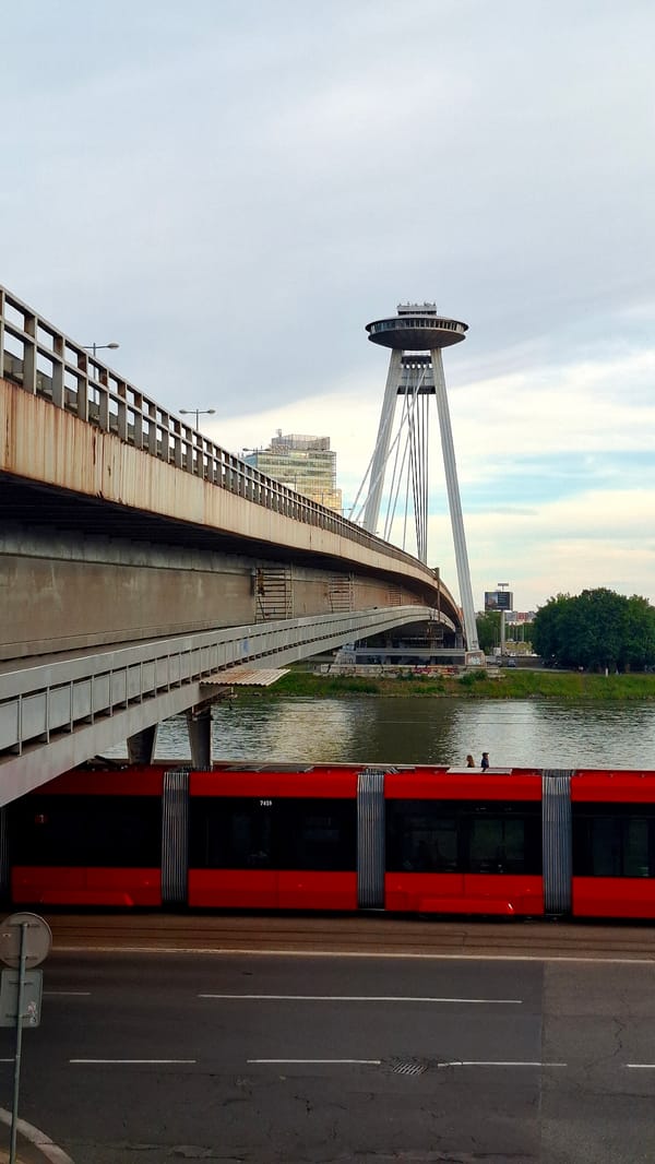 Tourists explore Bratislava's Old Town landmarks during afternoon walkabout