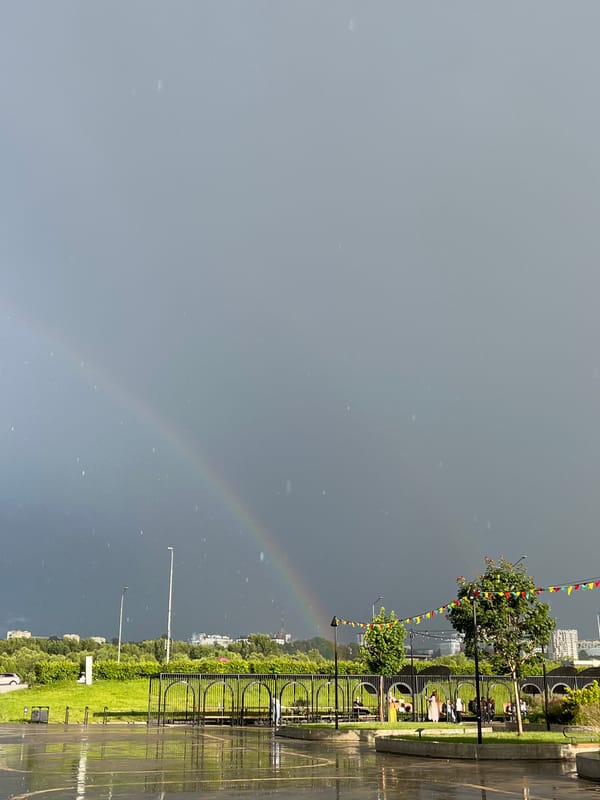 Double rainbow over a wet Nizhny Novgorod plaza after rain