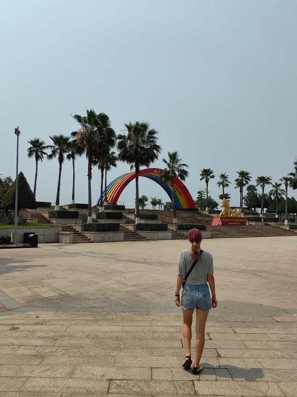 Woman walks through Bai Chay Ward park early morning