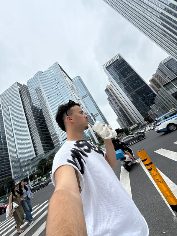 Man takes selfie with food container on Nanshan street
