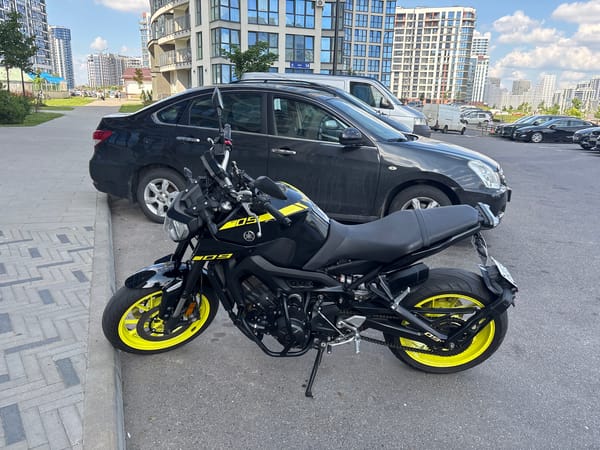 Modern residential complex in Minsk, motorcycle parked out front