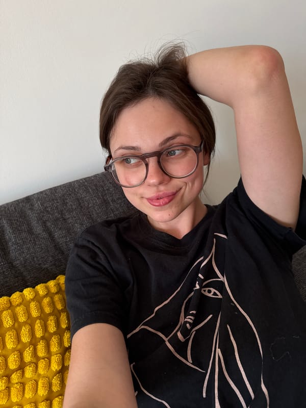 Woman rests on sofa in Hungarian lakeside town living room