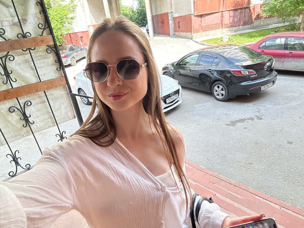 Woman in white documented across multiple locations during morning hours