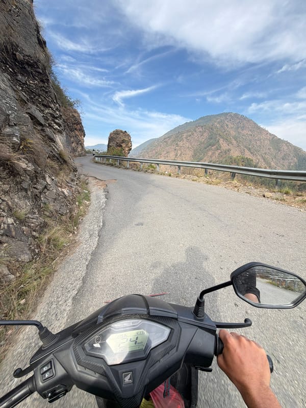 Vehicle travels mountain road in Indrasarowar Nepal