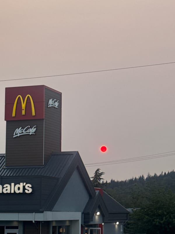 Wildfire smoke turns Coquitlam skies red over urban streets