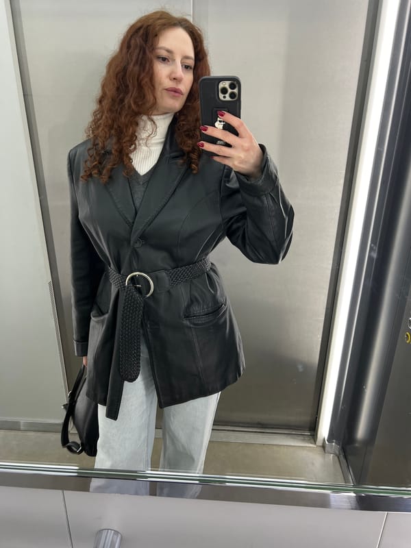 Woman takes mirror selfie in Saint Petersburg elevator