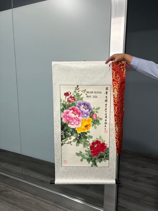 Person examines Chinese peony scroll painting in Cuautitlán Izcalli