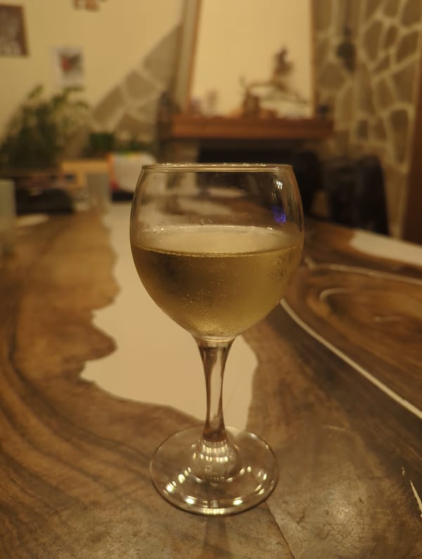 Champagne glass spotted on wooden surface in Septemvri interior