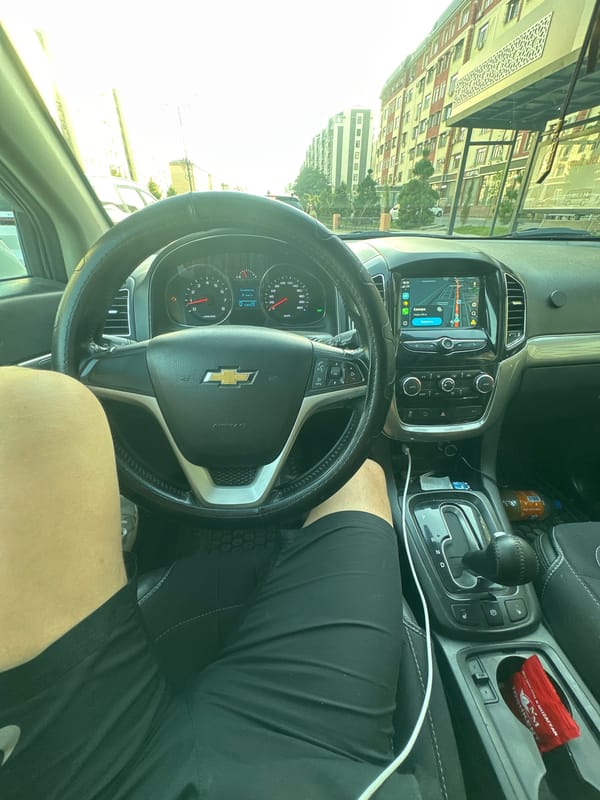 Driving through Tashkent at golden hour in a Chevrolet
