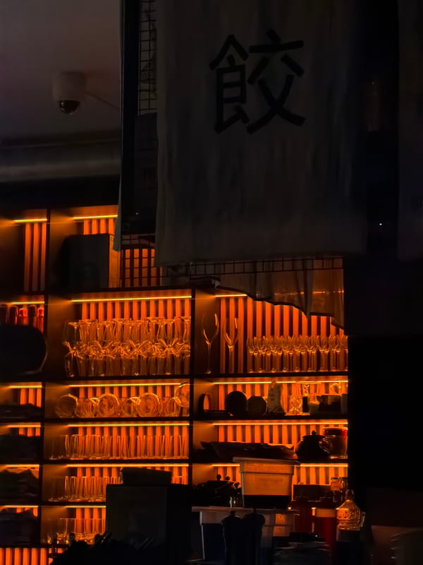 Evening bar scene captured in Gdańsk with Japanese signage