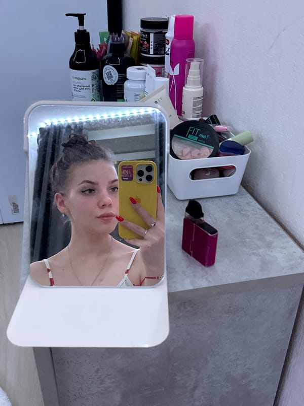 Mirror selfie captured with yellow phone in Yekaterinburg