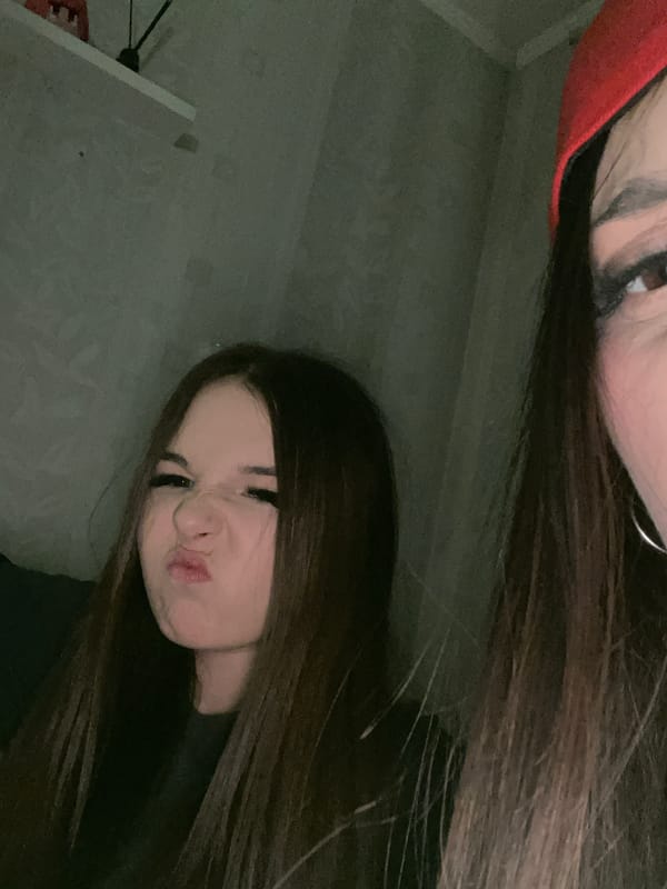 Two people photographed indoors in dim lighting, Saint Petersburg