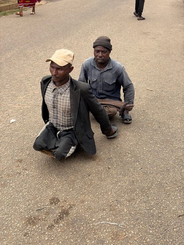 Everyday street life in Jos, Nigeria on a cloudy afternoon.