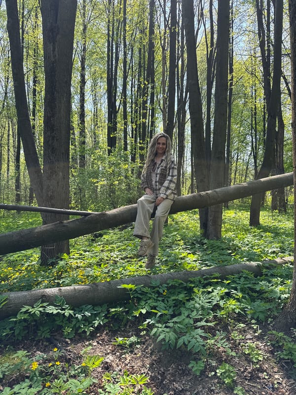 Woman and child enjoy forest outing in Rusanovo