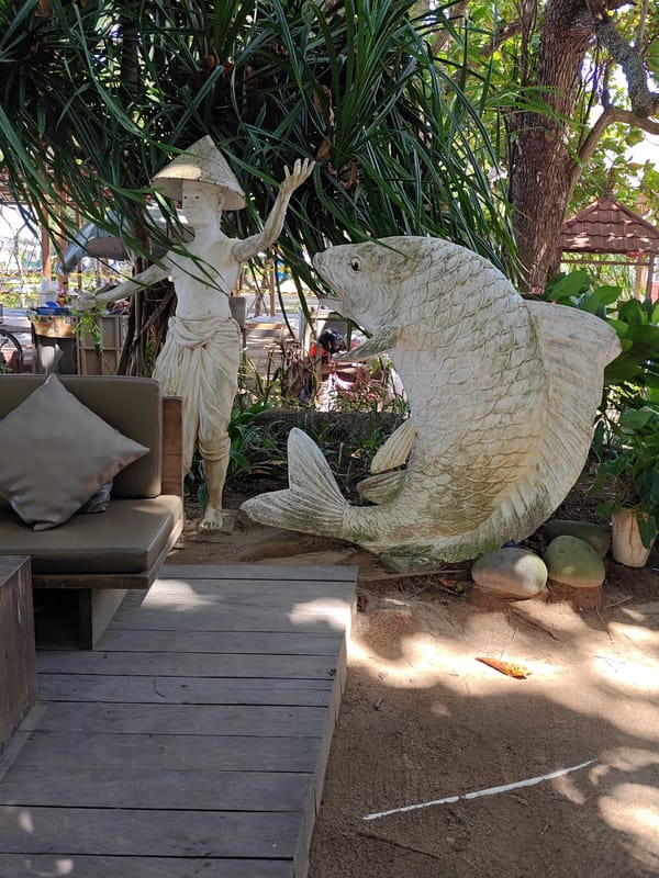 Statues observed in outdoor Denpasar setting early morning