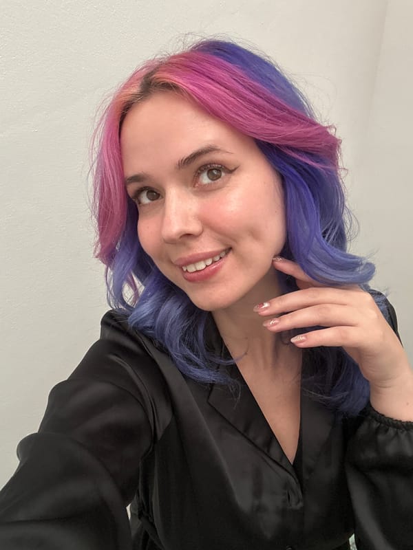 Woman takes colorful-hair mirror selfies in Zagreb apartment