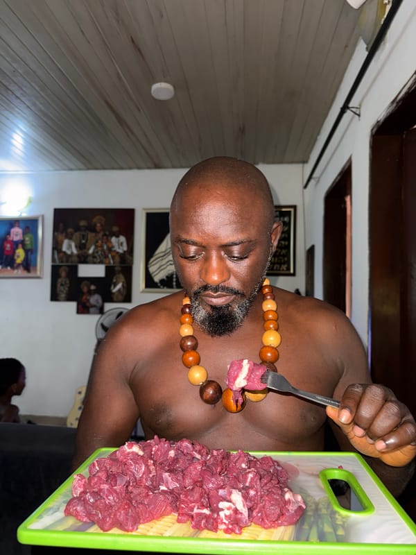 Man with wooden necklace photographed in Ado, Nigeria