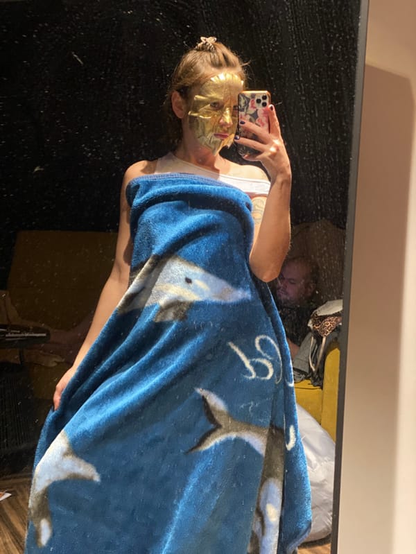 Person takes mirror selfie wearing gold mask in Russia