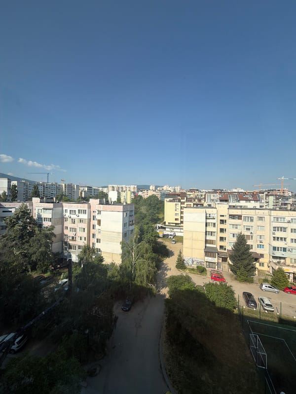 High-rise balcony views across a sunny Sofia neighborhood