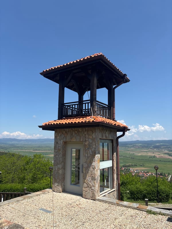 Visitors document medieval fortress complex during morning tour in Bulgaria