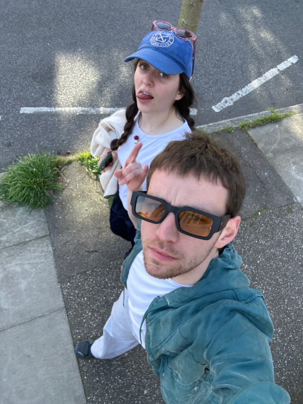 Couple photographed and filmed walking on London sidewalk