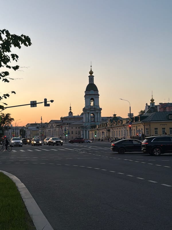Evening street life captured near Moscow's Seven Sisters tower