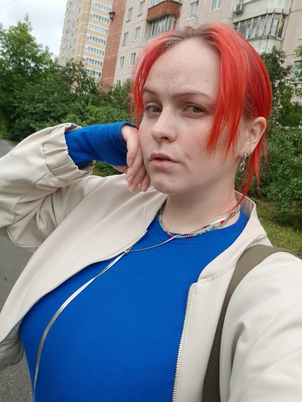 Two quick portraits, red hair, neutral look, outdoors
