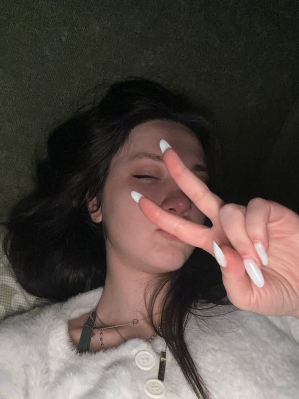 Woman in white sweater observed resting in Yerevan